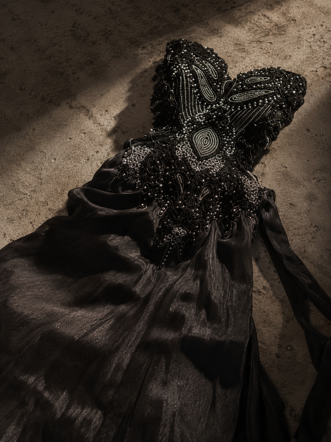 Black sculptural bustier with dimensional hand embroidery by Santana Luxe Label